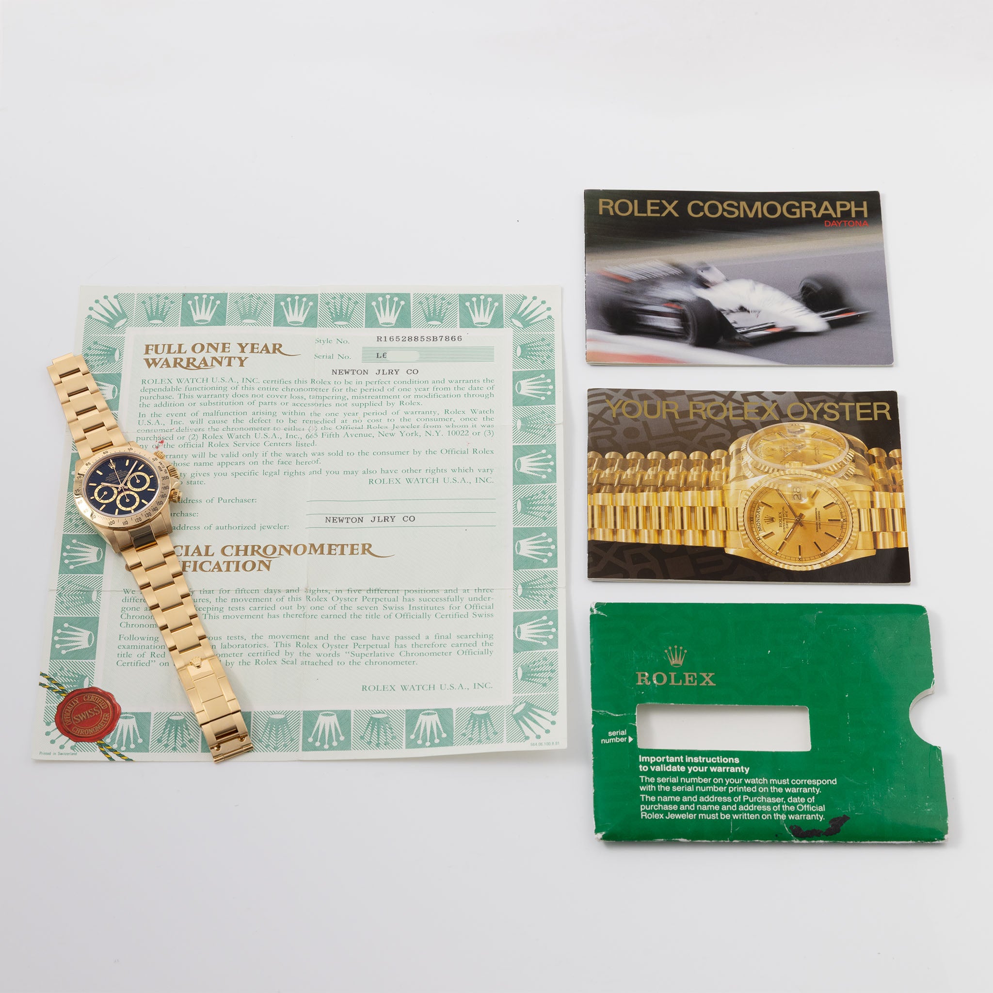 Rolex Cosmograph Daytona 16520 Black Floating Dial in 18k Yellow Gold with Original Guarantee Paper and Accessories
