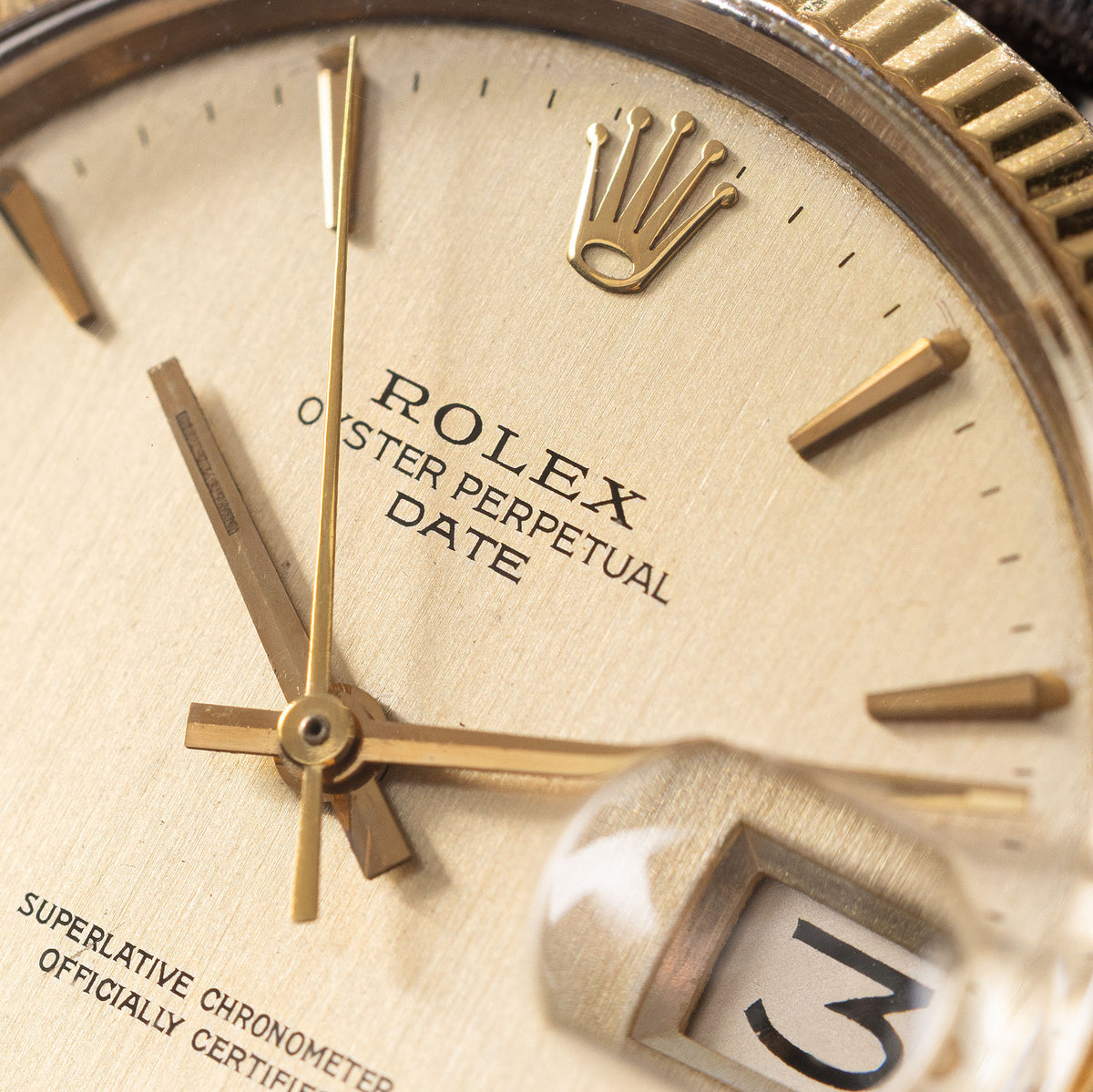 Rolex Oyster Perpetual Date 1503 in 18k Yellow Gold Vertical Brushed Champagne Dial