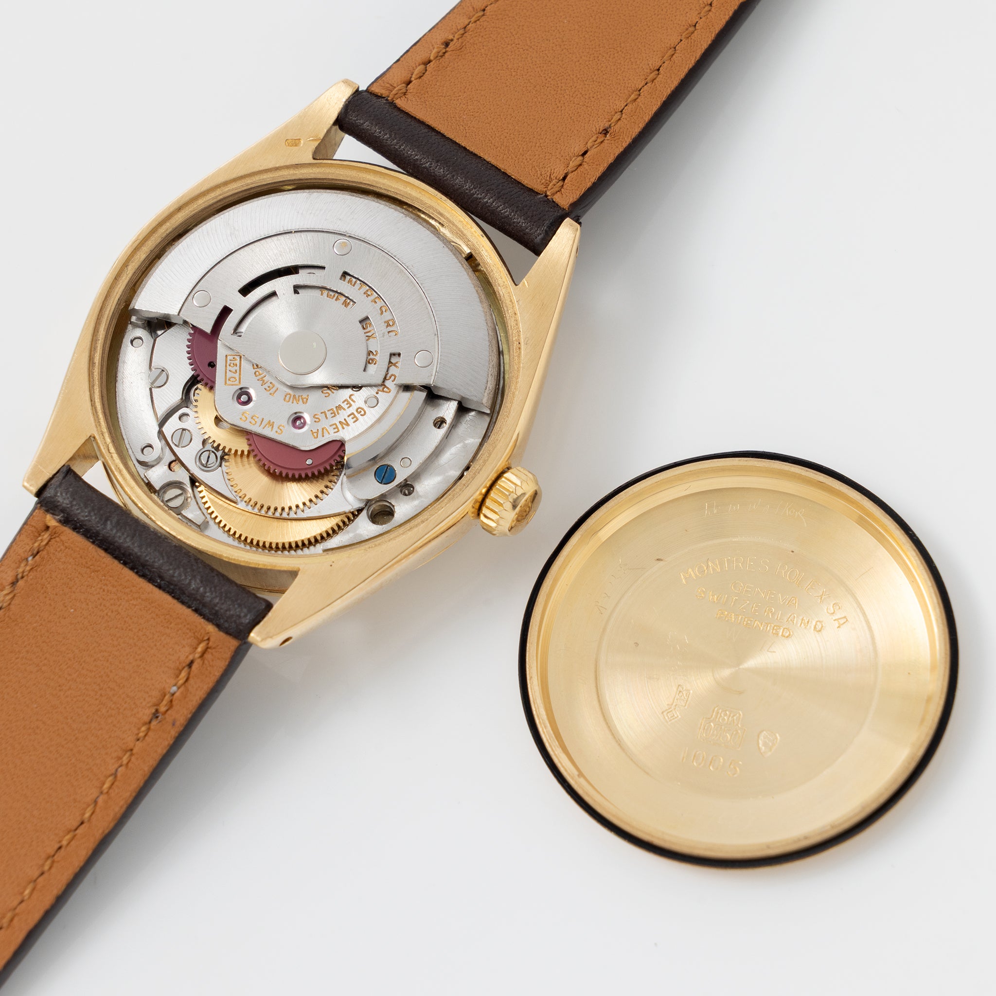 Rolex Oyster Perpetual Vertical brushed Champagne Dial in 18 k Yellow Gold ref 1002
