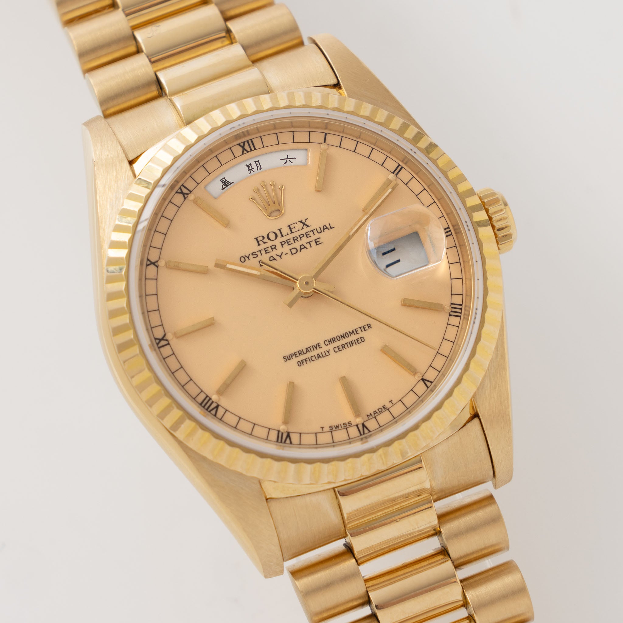 Rolex Day-Date 18238 rare Apricot Stella Dial with Original Guarantee paper in 18k yellow