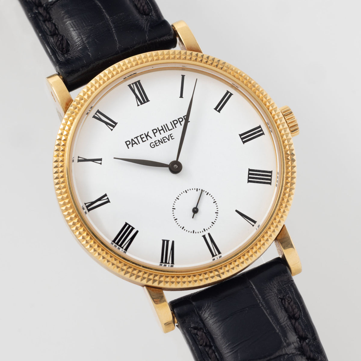 Patek Philippe Calatrava Ref 7119J 18k Yellow Gold Clous de Paris with White Roman Dial