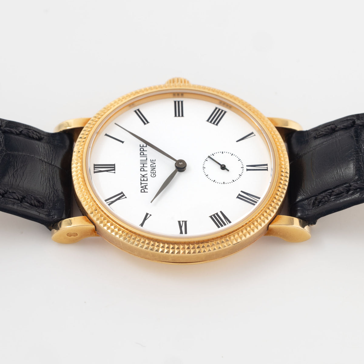 Patek Philippe Calatrava Ref 7119J 18k Yellow Gold Clous de Paris with White Roman Dial